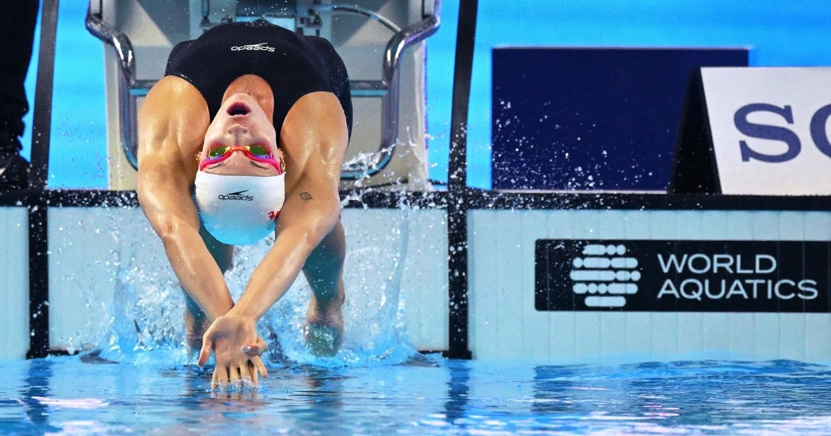 American Smith fastest in 100 backstroke heats, Ledecky dominates 1,500