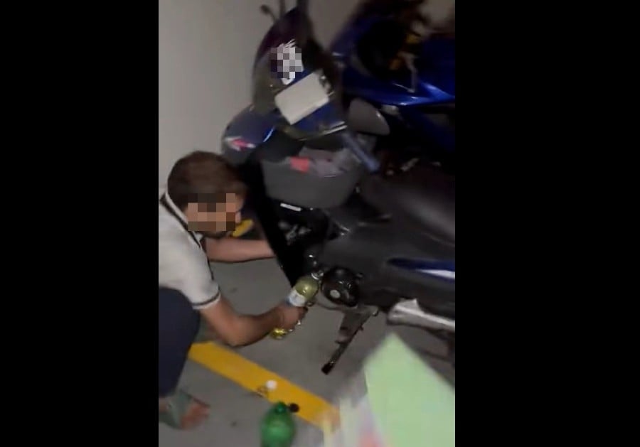 Duo caught red-handed stealing petrol from motorcycle at Johor apartments