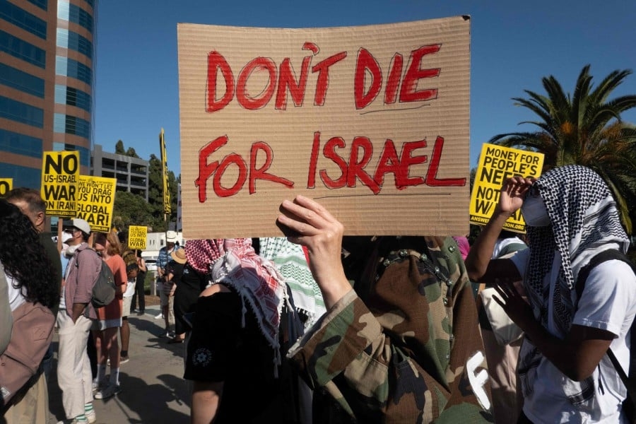 US moves aircraft, ships and restricts access to Qatar base as Iran-Israel tensions escalate