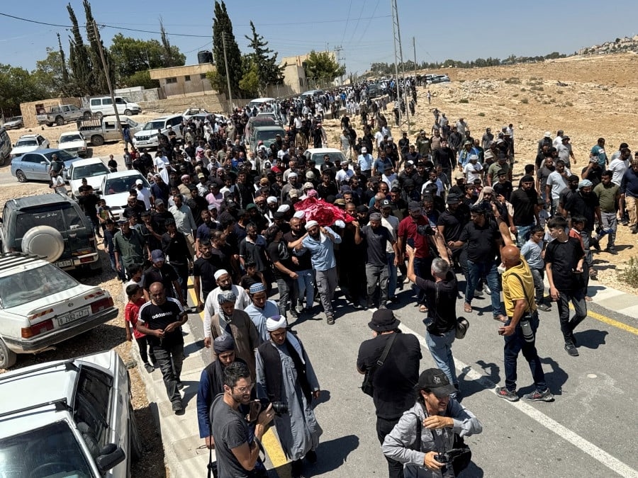 Palestinians bury activist Awdah Hathaleen shot dead by West Bank settler