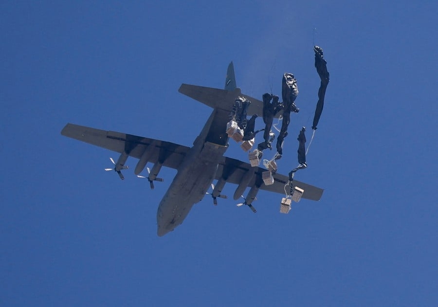Food airdropped into Gaza as Israel says opening aid routes