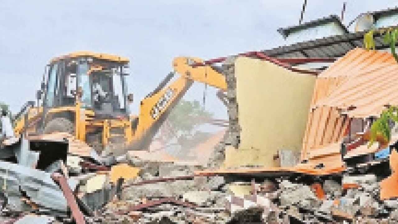 Bulldozers raze illegal ashram of arrested self-styled seer