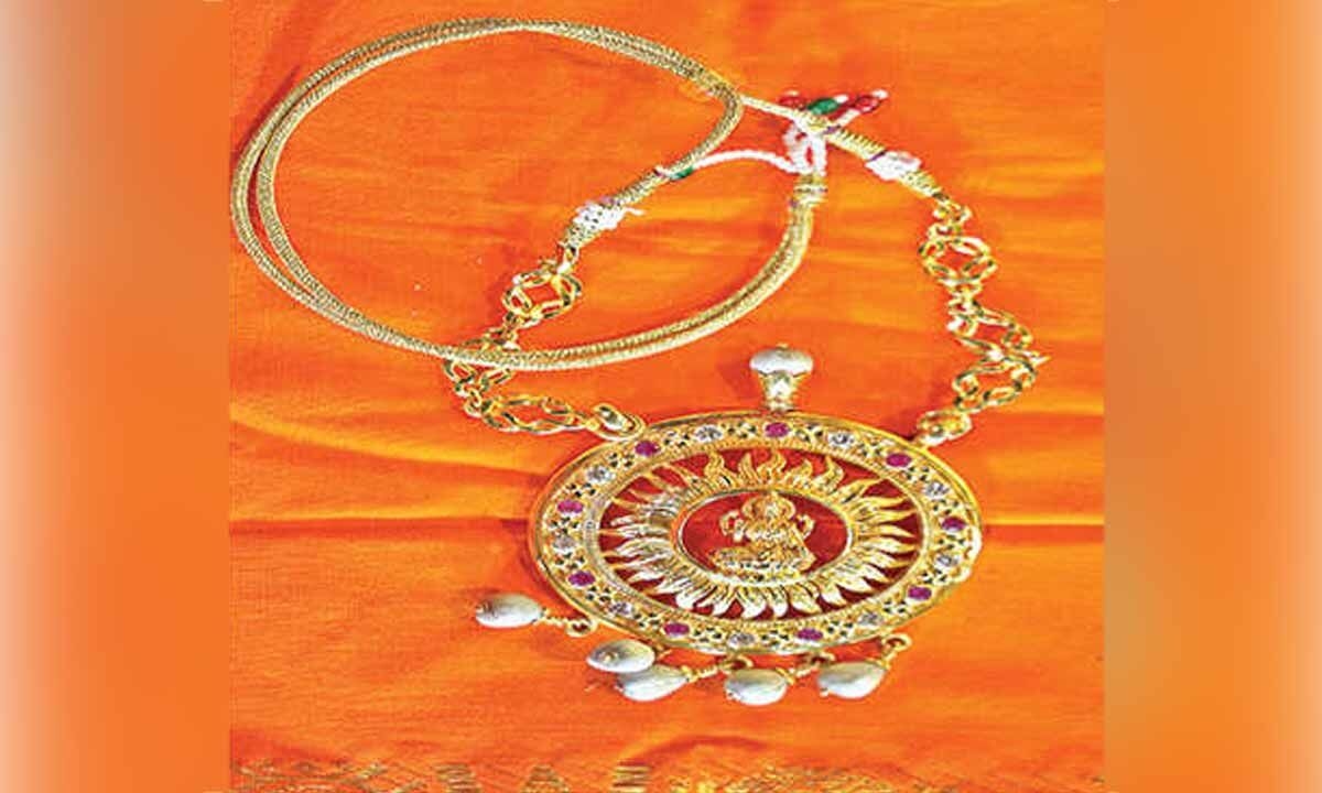 Golden Lakshmi pendant donated to Lord