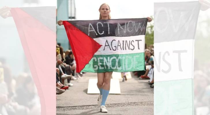 Model removed from catwalk at Copenhagen Fashion Week for raising Palestinian flag