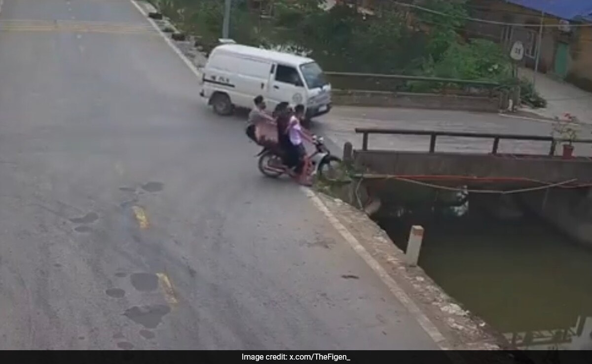 On Camera, Narrow Escape For Pillion As Bike Crashes Into Stream