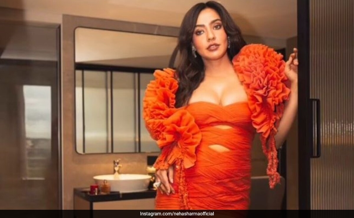 Neha Sharma Adds A Pop Of Vibrant Orange To Her Summer Closet In A Cutout Gown