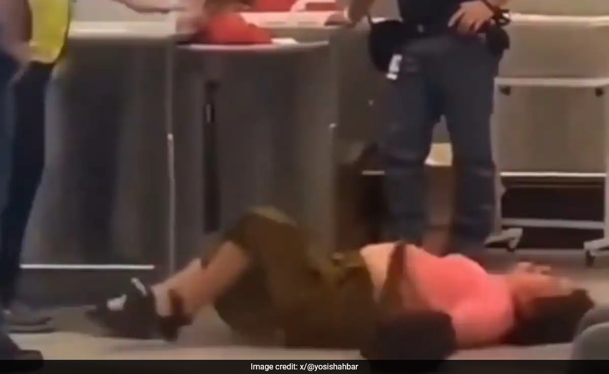 Video: Chinese Woman Rolls On Floor At Italy Airport After Being Told Her Luggage Is Too Heavy