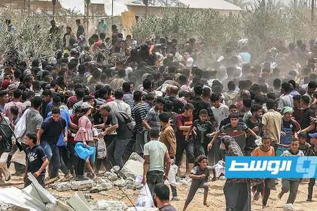 20 شهيدا بنيران جيش الاحتلال قرب مركز لتوزيع المساعدات في غزة