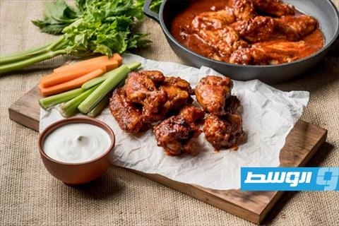 أجنحة دجاج بالصويا صوص وزيت السمسم