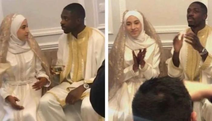 بالكمامة والحجاب.. زوجة عثمان ديمبلي تخطف الأنظار (صور)