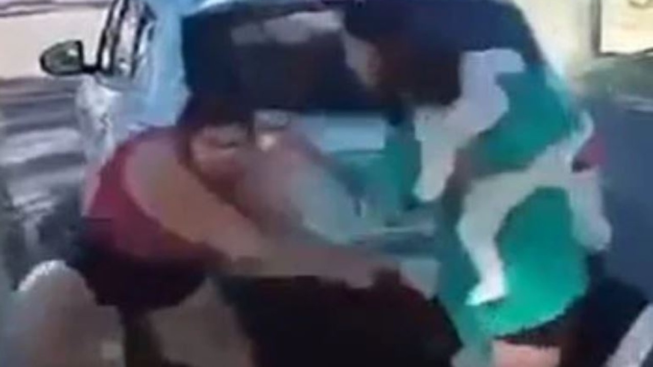 Wild footage shows mother with baby breaking up brawl in Mount Isa