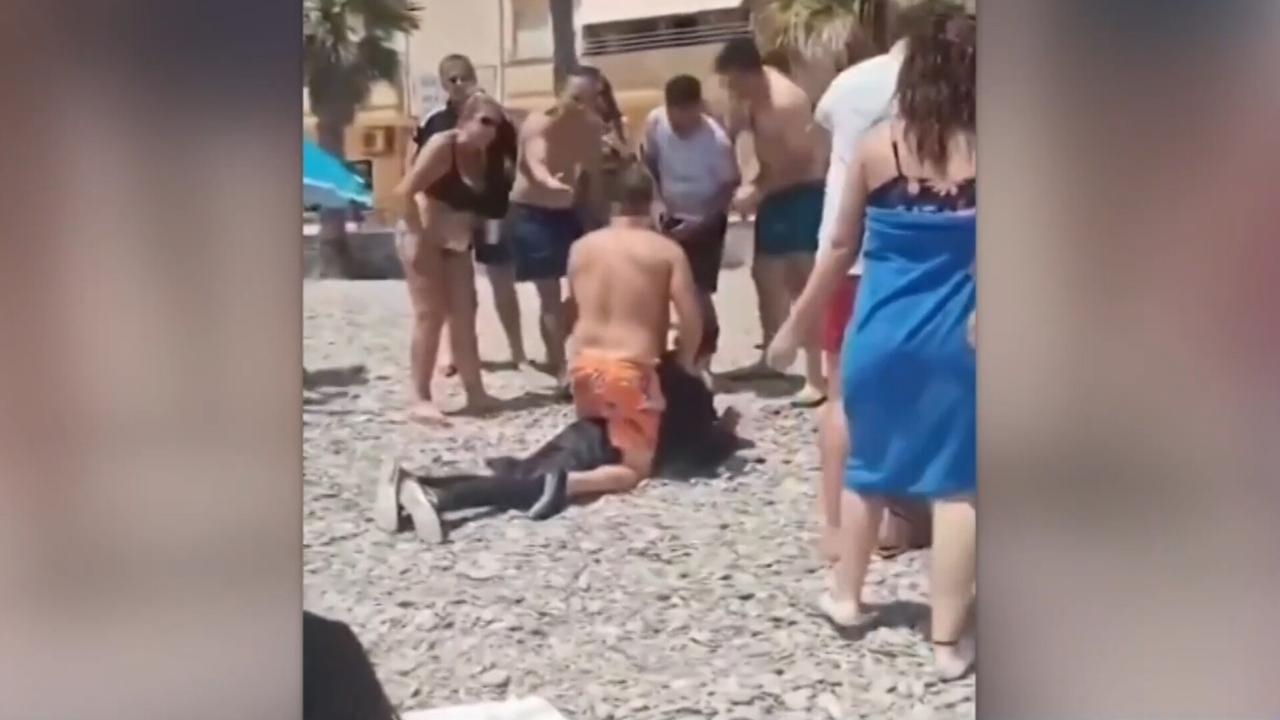 Spanish beachgoers ‘take matters into their own hands' and tackle illegal migrants to the ground