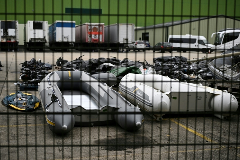 UK says first migrants held under return deal with France