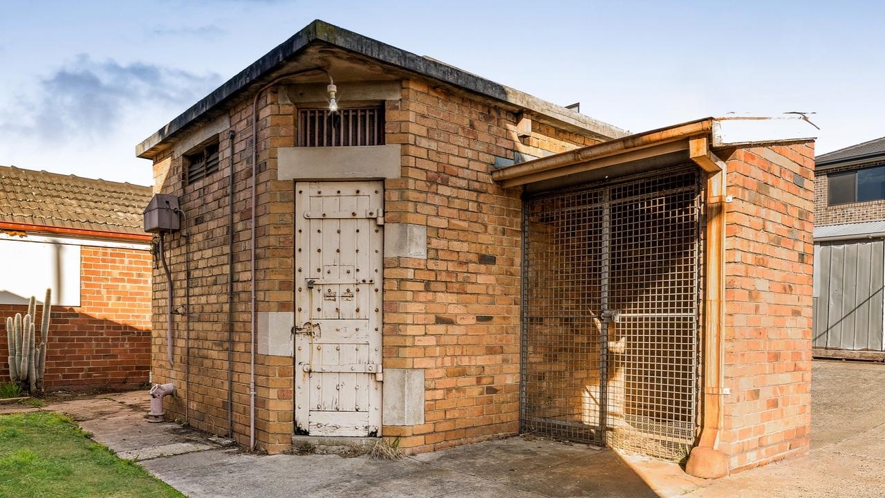 Ex-police station with a backyard jail cell sells for $1m+