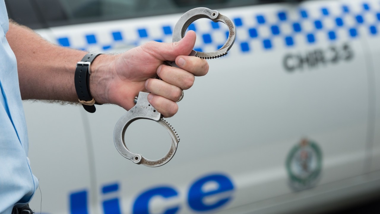 Man allegedly covers Sydney complex in swastikas, attacks police while in custody