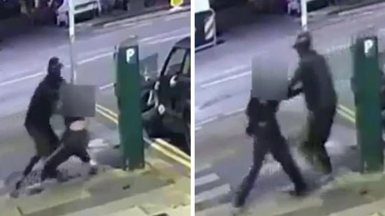 Harrowing moment man snatches woman off street at random