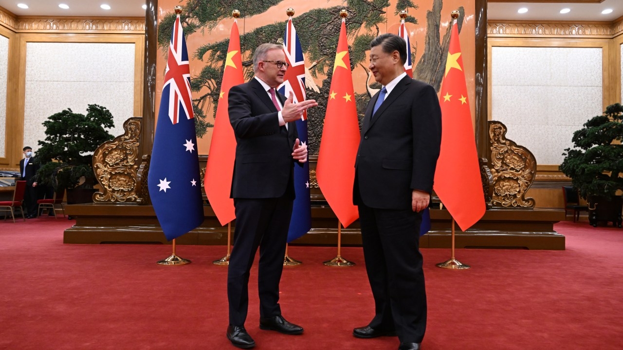 Two international relations experts weigh threat of China against Australia's 'confusing' ally as tensions rise in the Indo-Pacific