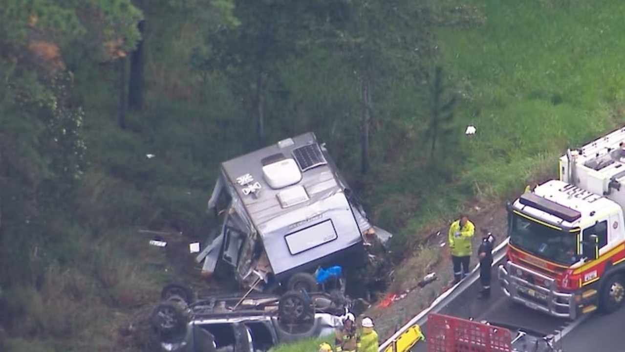 Two people fighting for life after horror caravan crash on Bruce Highway