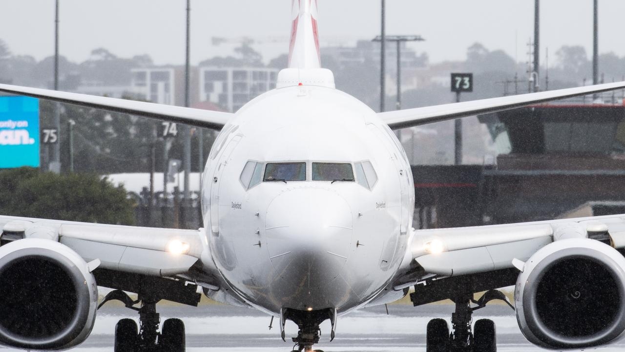 ‘Bizarre behaviour': Charges dropped for man who tried to open plane doors mid-flight