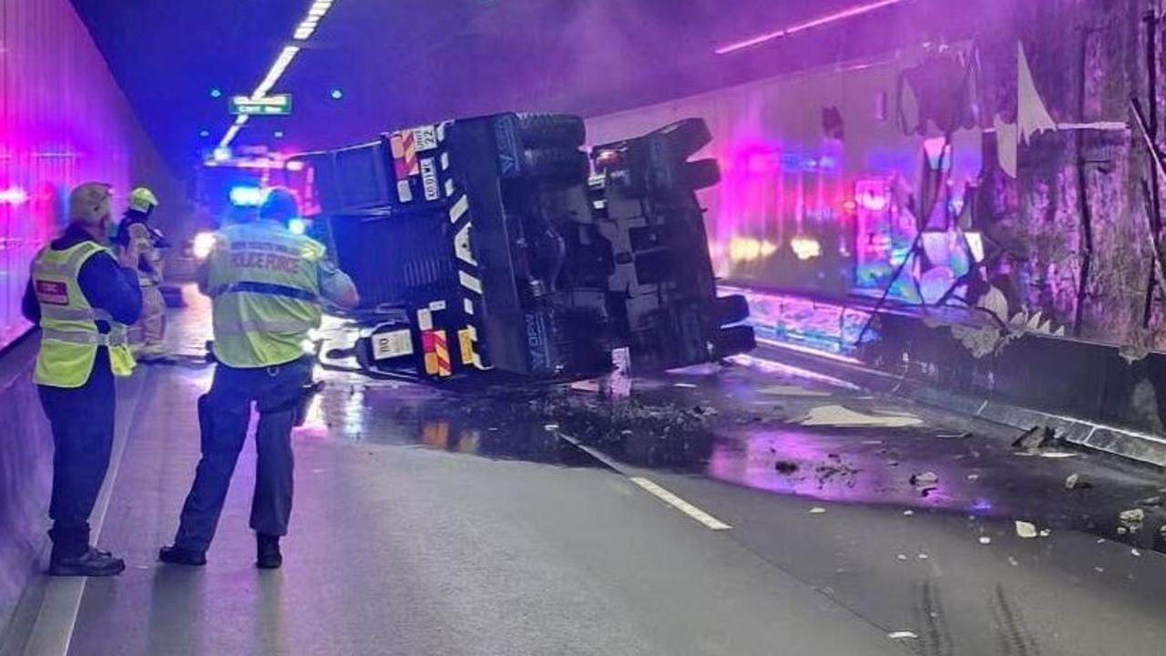 Chaos on Sydney M5 Motorway shut after crane crashes on its side