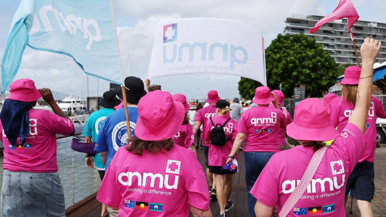 Frontline health workers warn of mass industrial action while Queensland health calls in the industrial commission to mediate pay talks