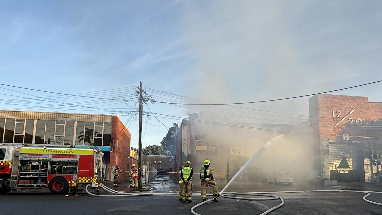 Thick smoke engulfs suburb as fire rips through factory units in Marrickville, Sydney