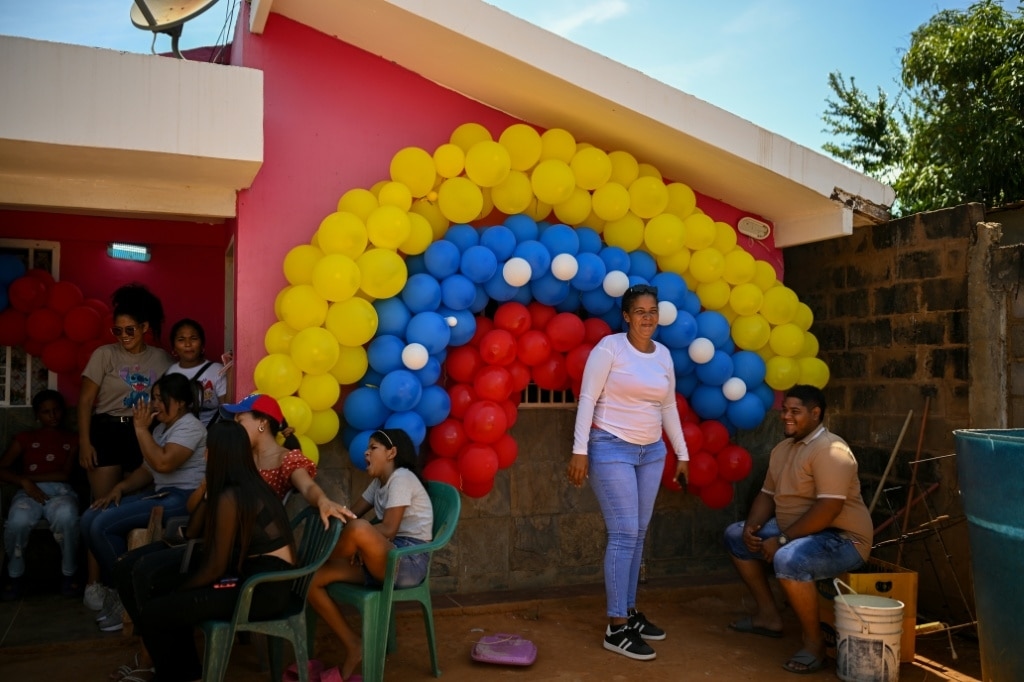 Tears of joy as Venezuelan migrants return from El Salvador prison 'hell'