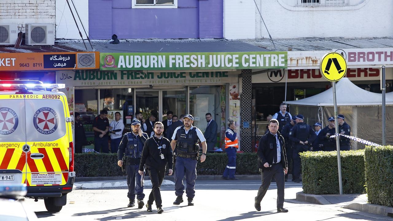 Police investigate whether burnt-out cars linked to kebab shop shooting at Auburn, Sydney