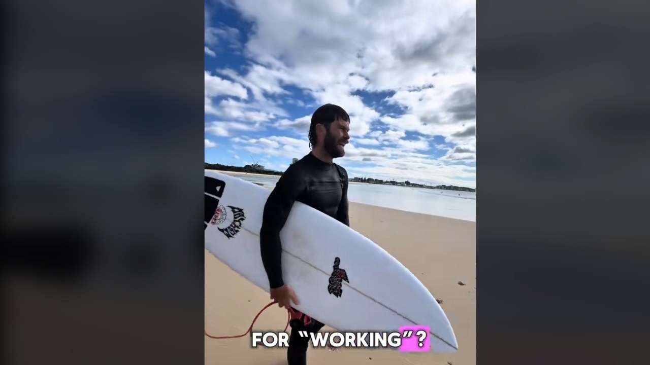 'They do virtually nothing': Footage of Aussie man being paid to surf while "working from home" goes viral