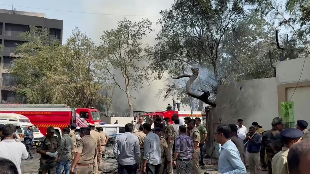 Flames and smoke in aftermath of crashed India passenger jet