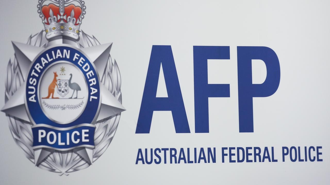 NSW Corrective Services officer charged with corrupt conduct offences after allegedly smuggling encrypted phone into jail