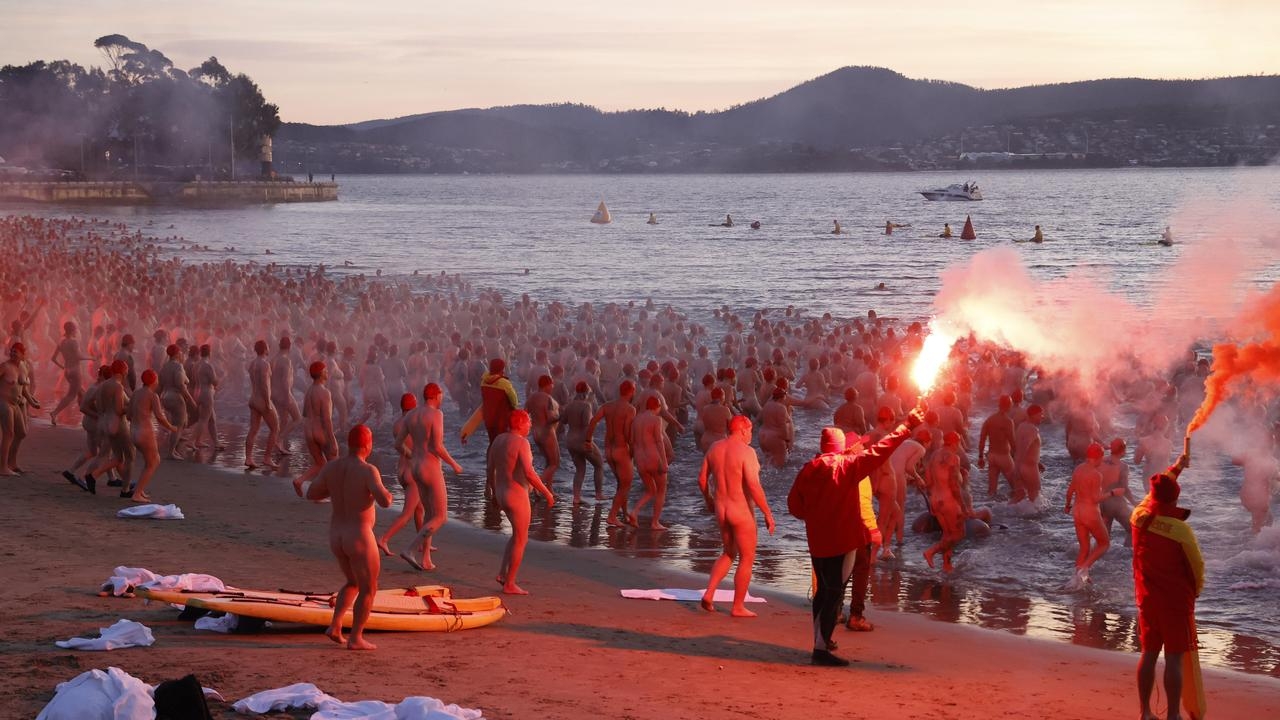 Wild scenes as thousands strip off for icy nude swim at end of Dark Mofo