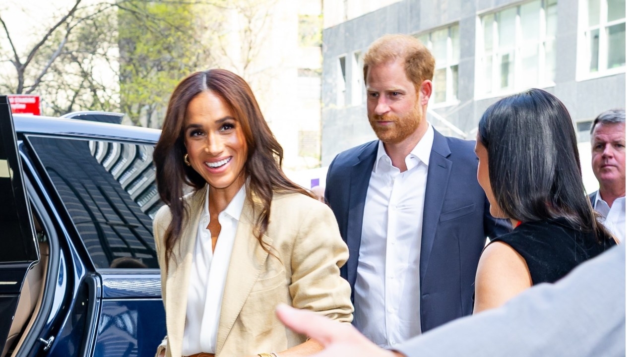 Mr Unimportant: Prince Harry takes on new role as Meghan Markle's 'assistant' after losing UK high court security case