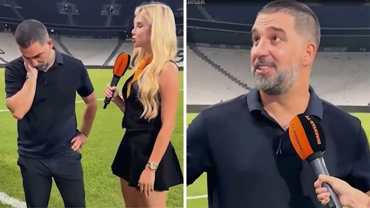 Awkward moment married football manager desperately avoids eye contact with reporter