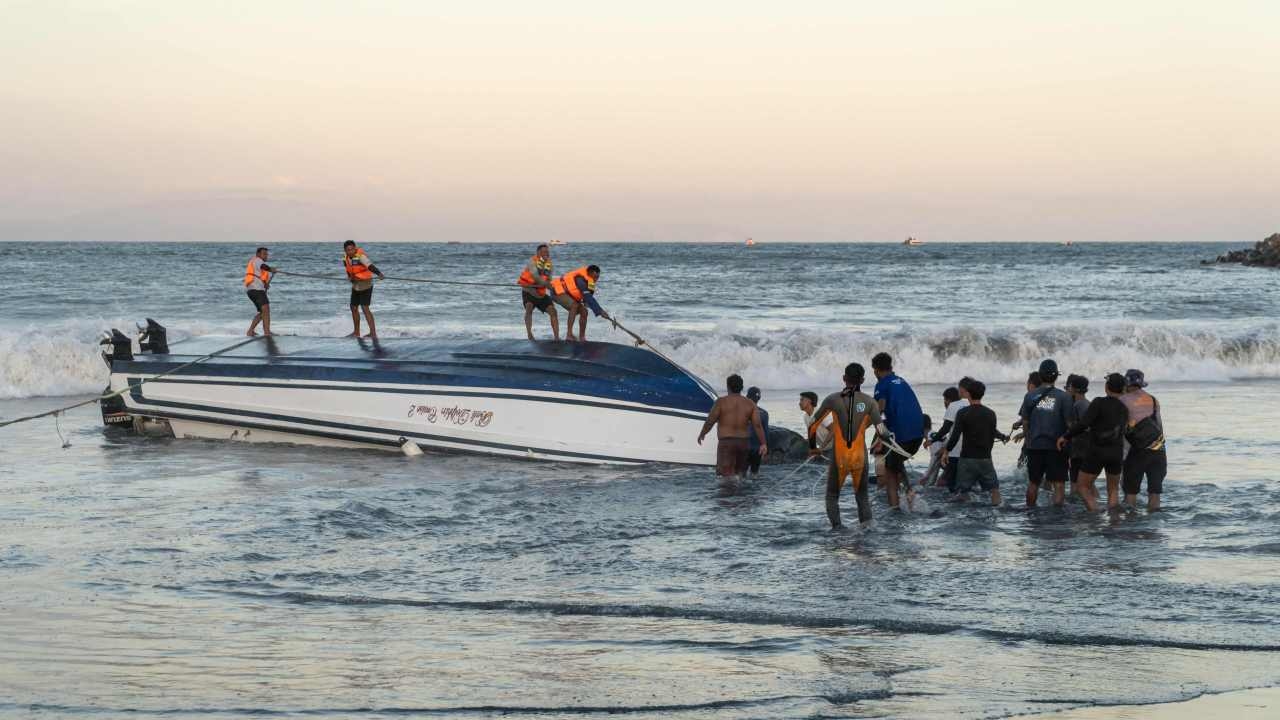 Conditions of five Australians among 80 tourists onboard capsized boat in Bali remains unknown as two people die, another missing