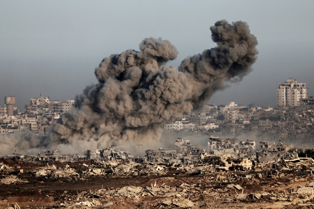 Gaza civil defence says Israeli fire kills 32 near two aid centres
