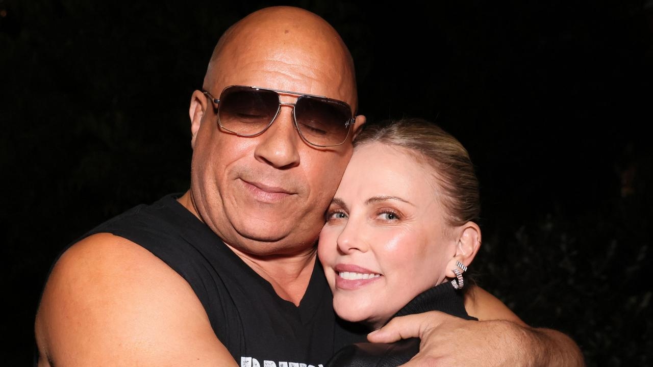 Vin Diesel shows off his new physique as he poses for pictures with his celeb pals