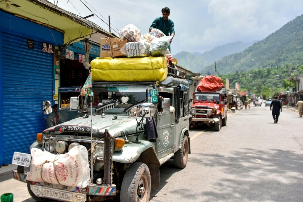Pakistan's Kashmiris return to homes, but keep bunkers stocked