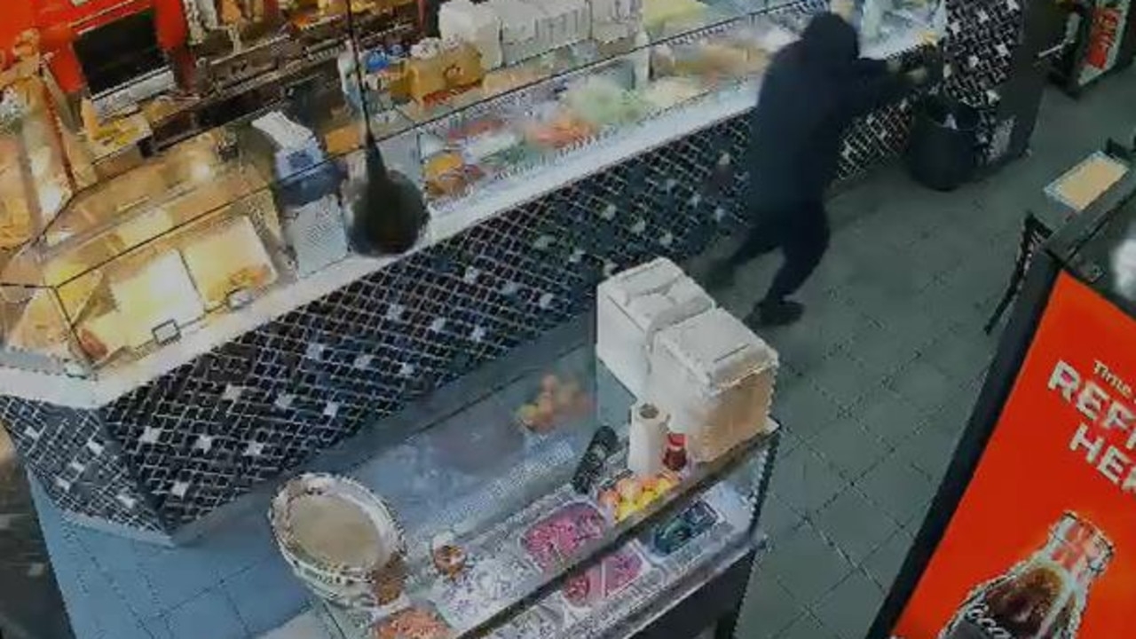 Moment two masked men storm a kebab shop captured on footage