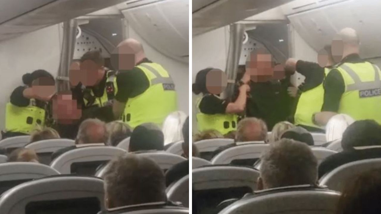 Moment ‘drunk' passenger hauled off flight by cops after punching cabin crew