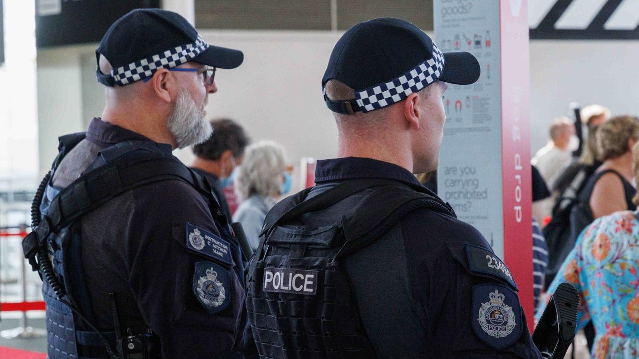 Flight attendants restrain wine-swilling passenger on plane's descent into Sydney