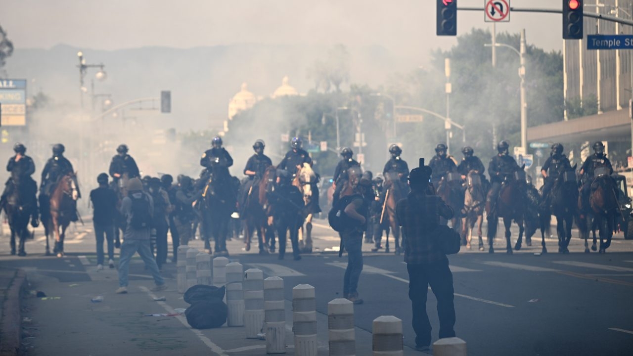 Los Angeles protests: City enters curfew after tear gas deployed during 'No Kings Day' demonstrations across the US