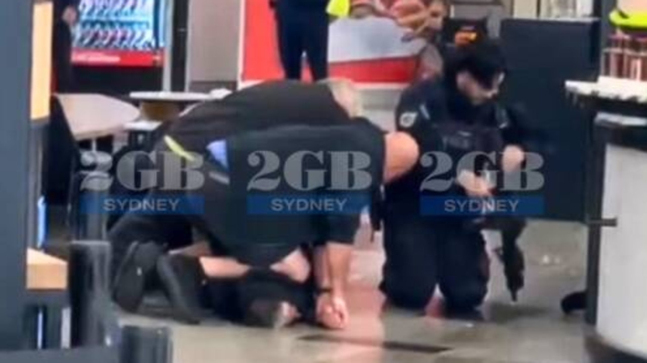Man arrested after police firearm discharged inside Sydney Airport terminal