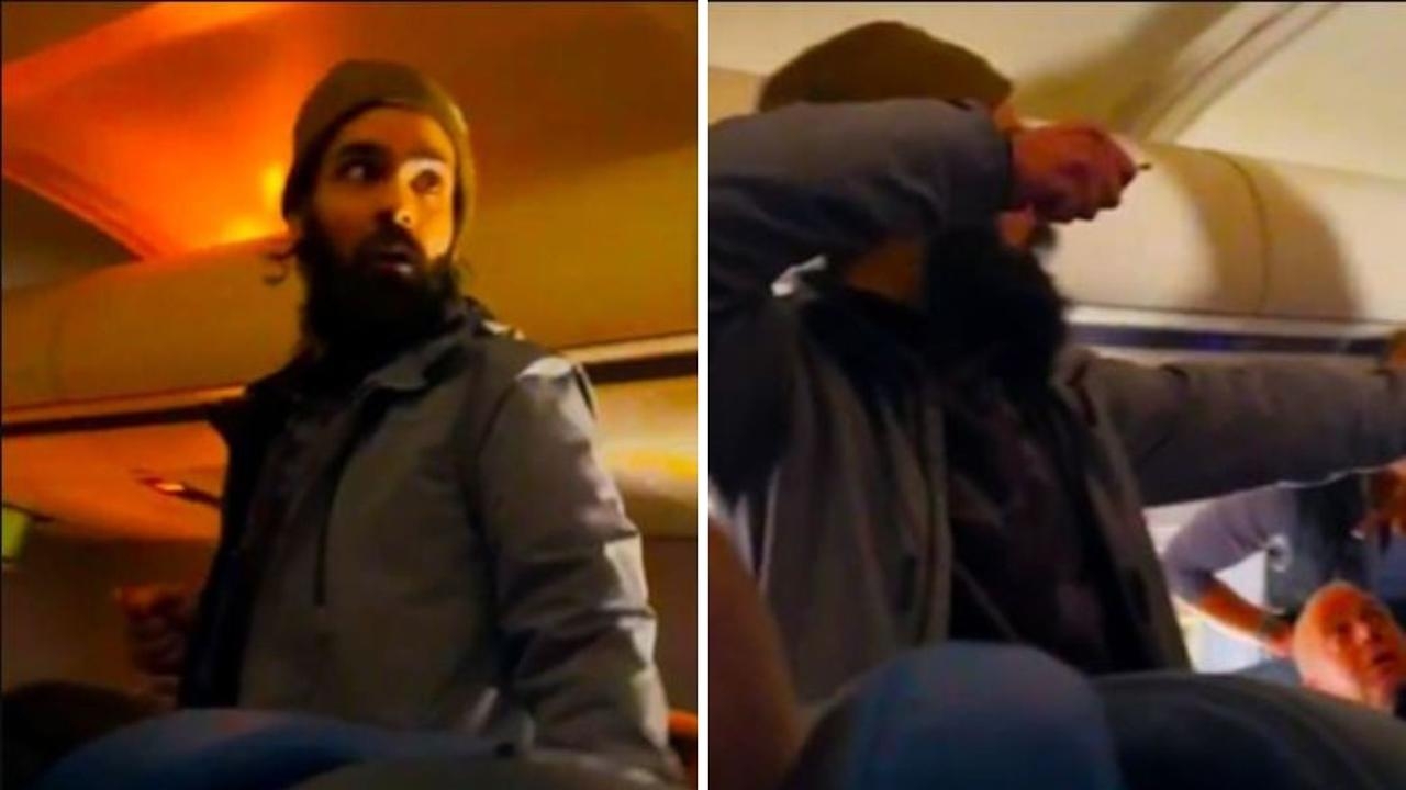 Shocking moment passenger tries to stab flight attendant and open emergency exit
