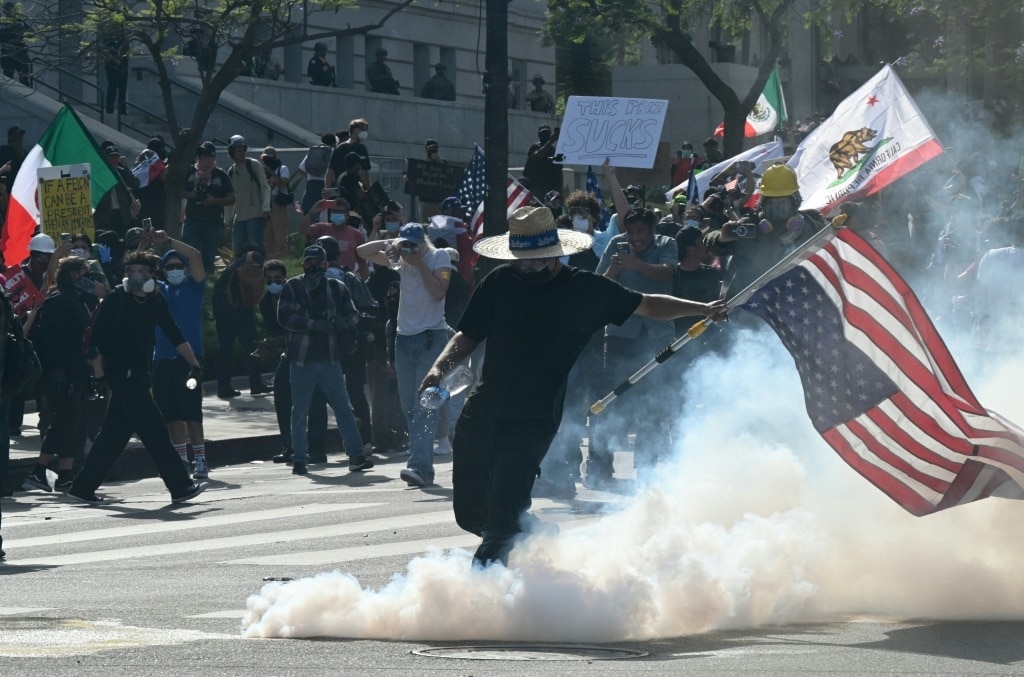 Trump's military parade kicks off as protests sweep US