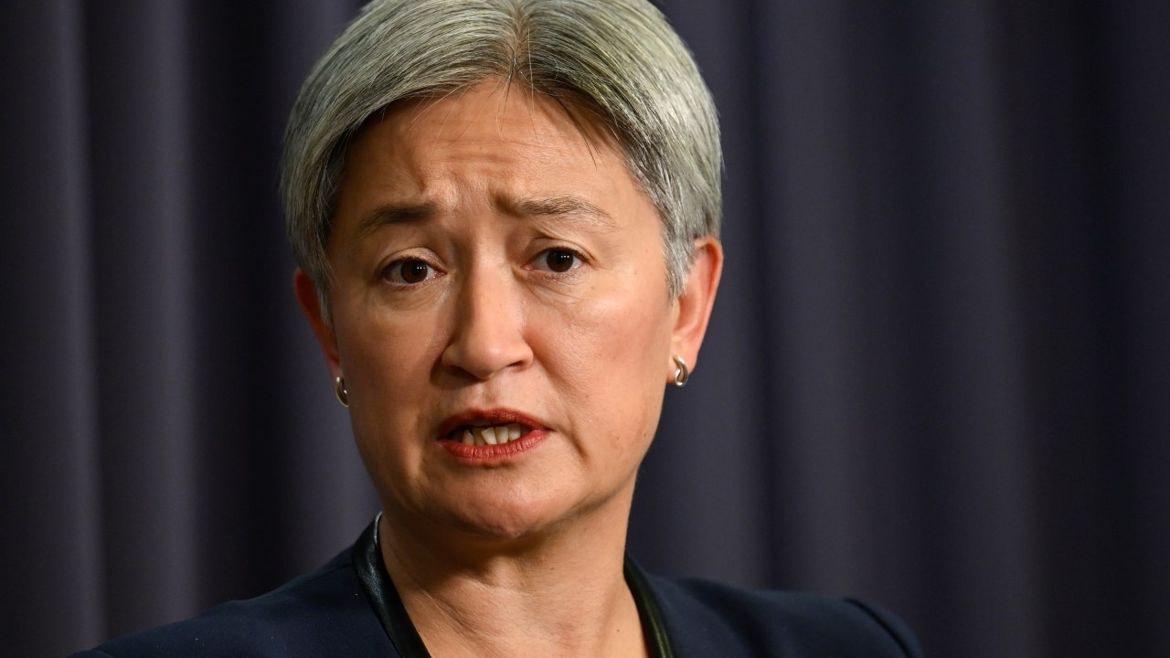 Penny Wong refuses to confirm whether she discussed Canberra woman charged with Chinese foreign interference with Beijing officials