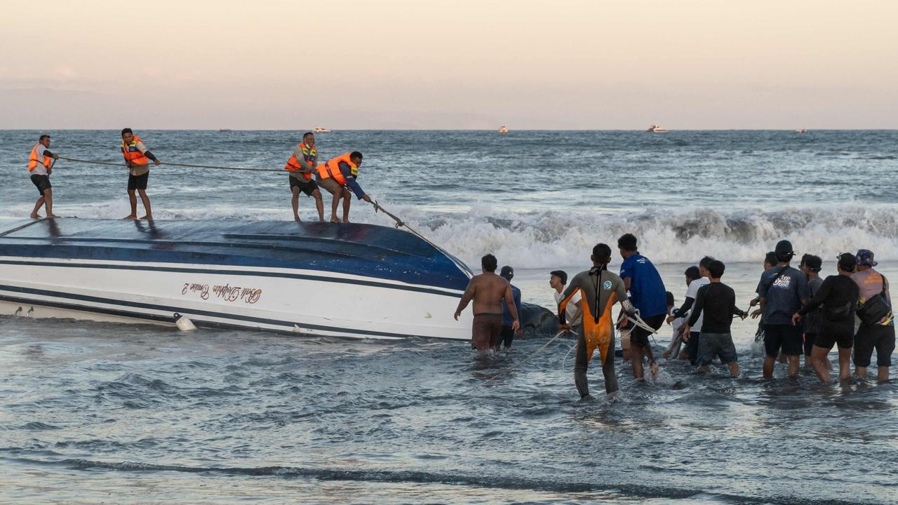 Two dead, five Australians injured after tourist boat capsizes in Bali
