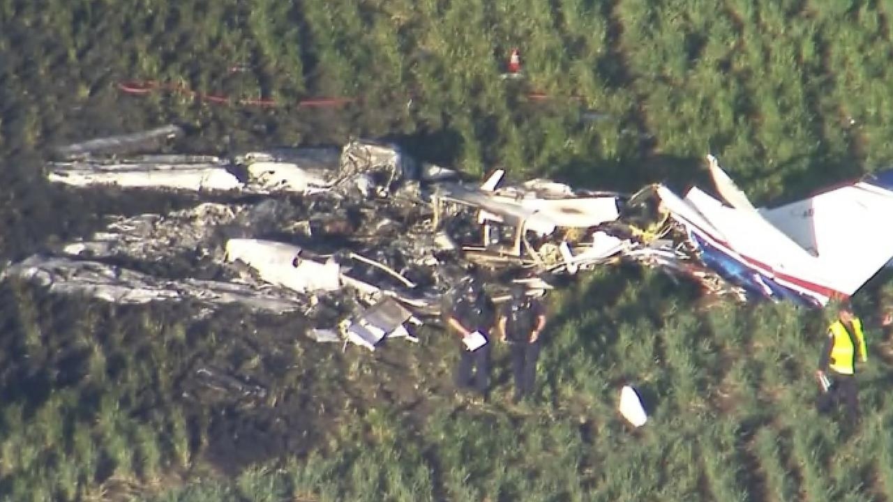 Two killed after light crashes into paddock, catches alight near Toowoomba, Queensland