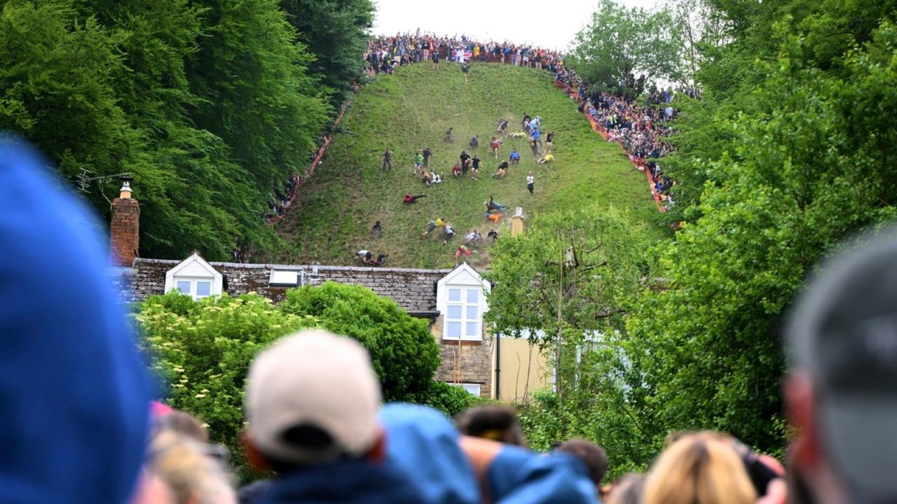 Competitors participate in annual Cooper's Hill cheese rolling race
