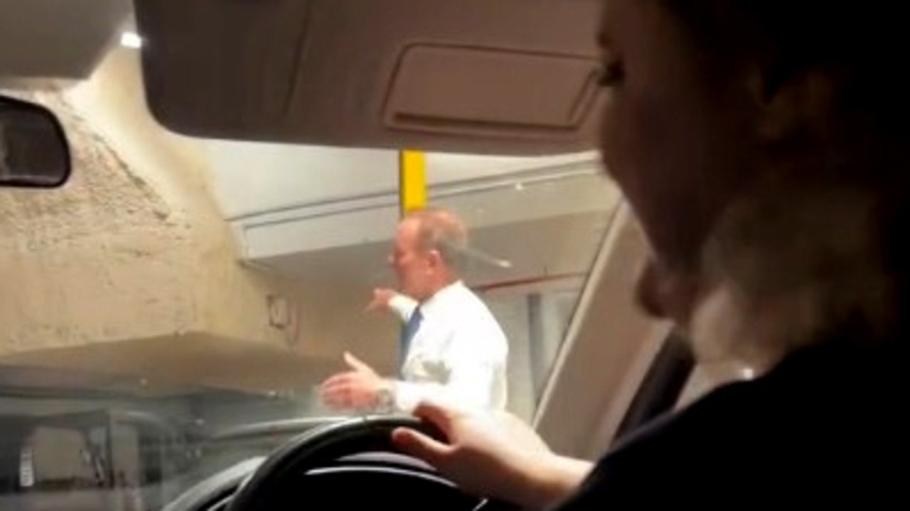Former PM Tony Abbott helps direct traffic in Sydney